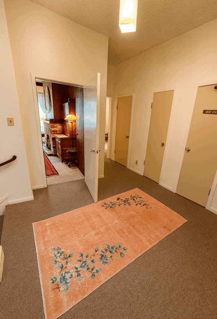 Interior hallway at Massage Grotto SF leading to private treatment rooms.